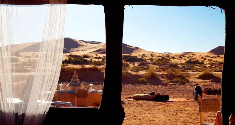 View of the desert through a tent opening