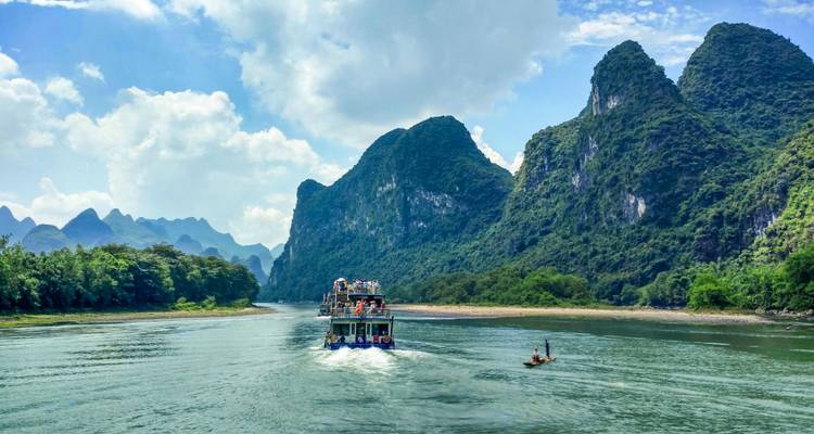 Boat journey along a scenic river.