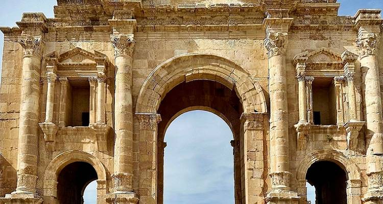 Impressive ancient stone arch with intricate carvings.