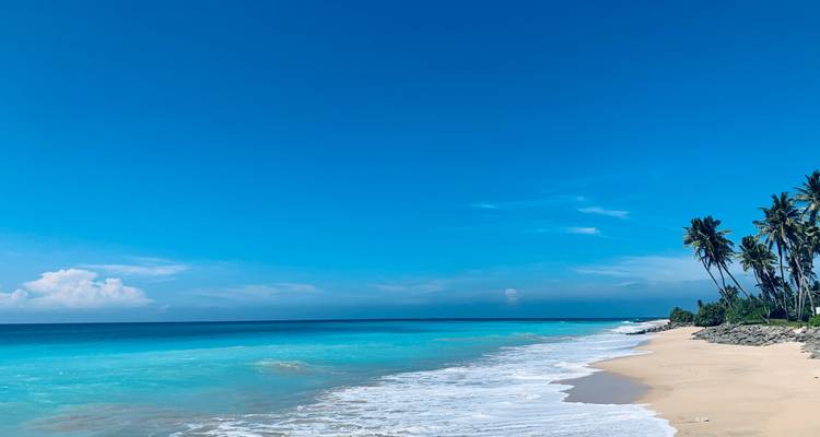 Pristine beach with white sand and turquoise water