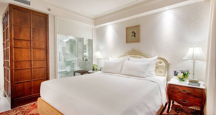 Elegant hotel room with plush bedding and decor