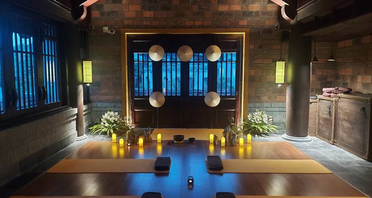 Meditation room with warm lighting and mats