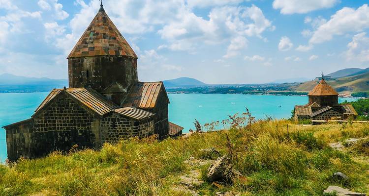 Historic church overlooking a bright blue lake