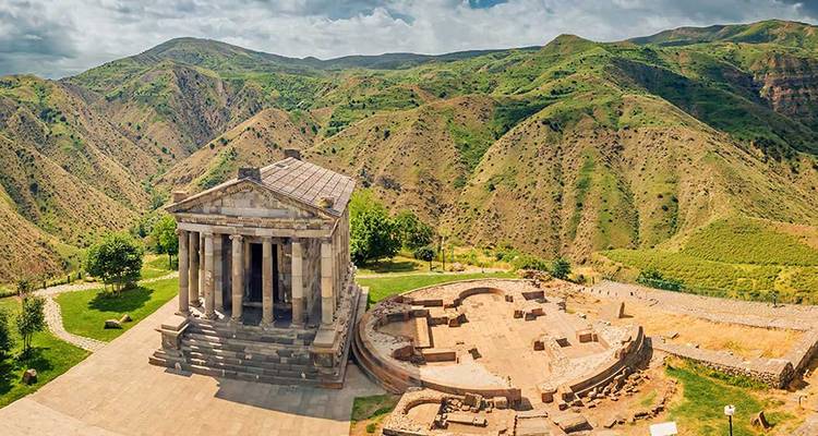 Ancient temple surrounded by green hills