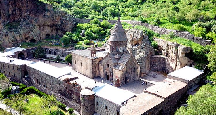 Ancient monastery set against a rocky cliff