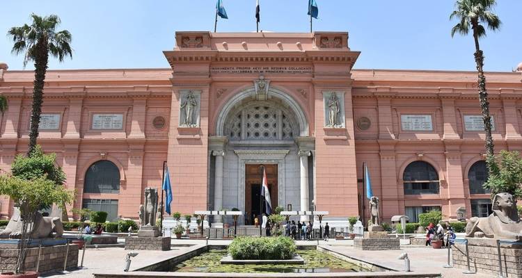 Facade of the Egyptian Museum with visitors present.