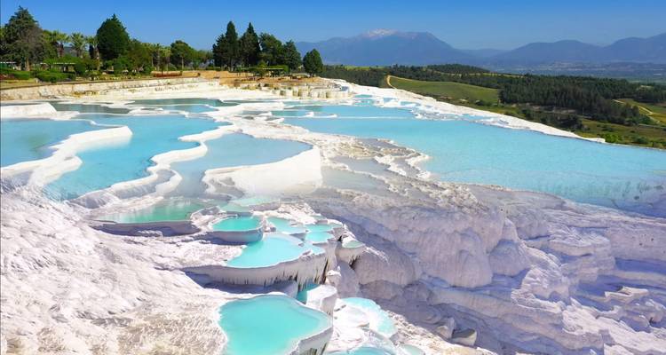Natural thermal pools with bright blue water.