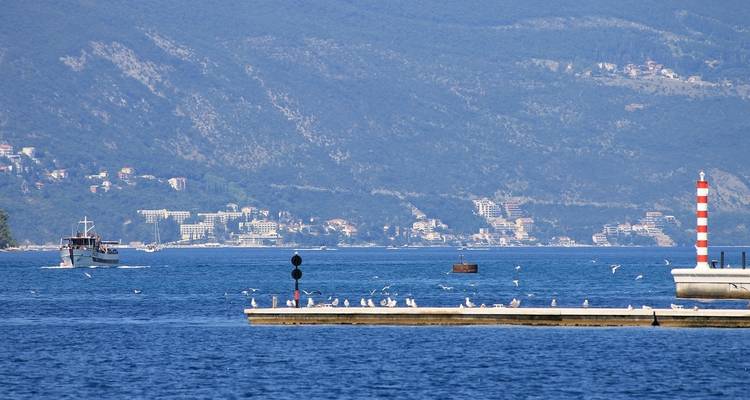 Boat on water with distant land.