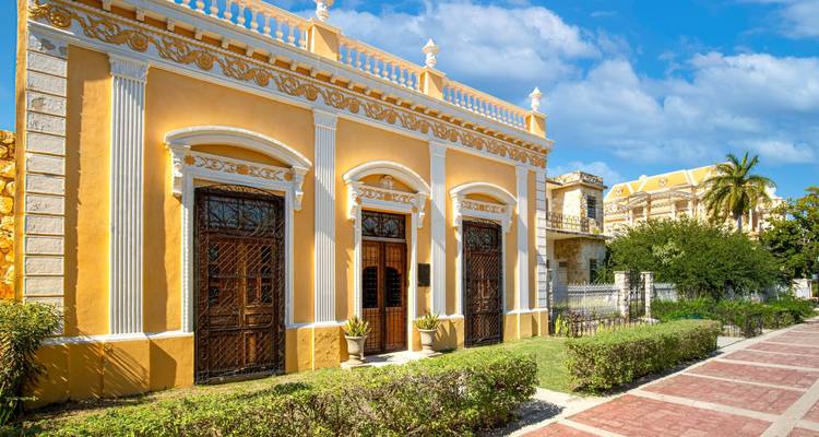 Historic yellow building with ornate architectural details.