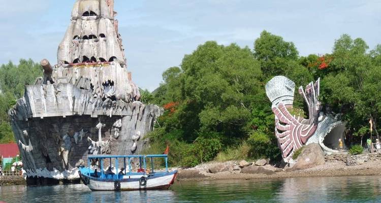 A whimsical landscape with a boat and artistic structures.