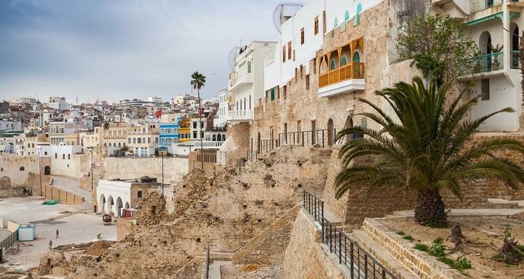 Historic medina in Tangier with a mix of old and new structures.
