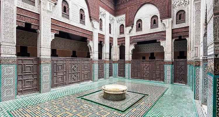 Decorative interior courtyard with intricate carvings and tiles.