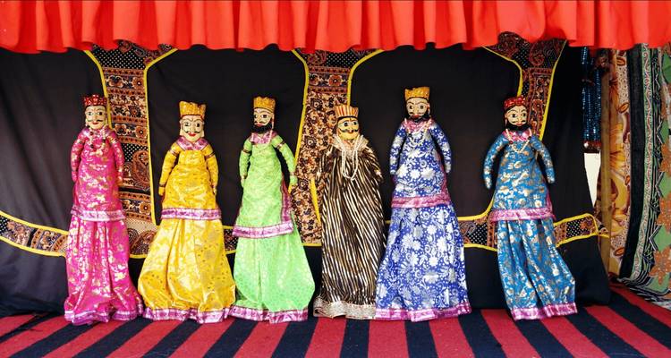 Traditional puppets in colorful costumes on display.