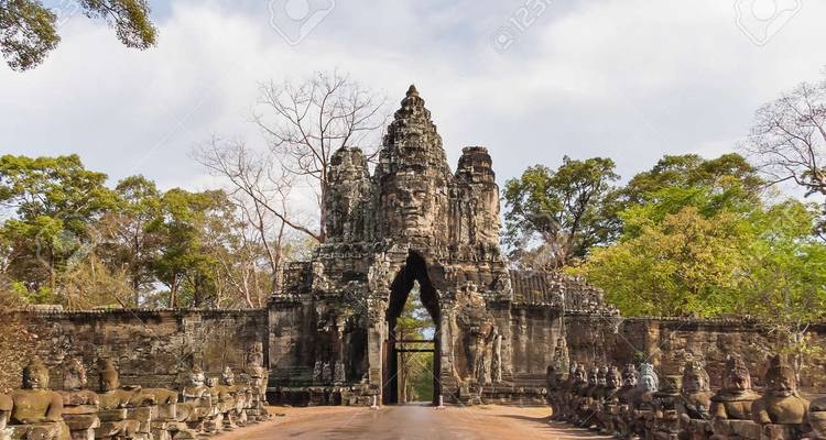 Stone gate with carved figures and a central path.