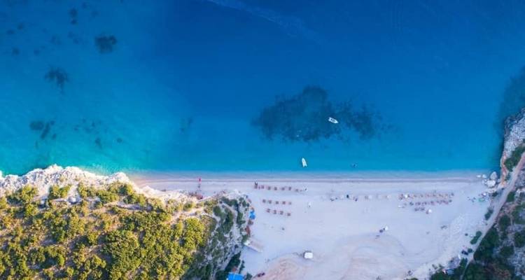Aerial view of a beautiful blue coastline and beach.