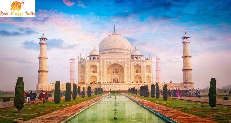 Taj Mahal with reflection in the water and visitors.