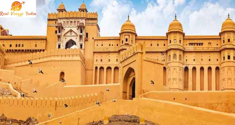 Amber Fort with blue sky and flying birds.