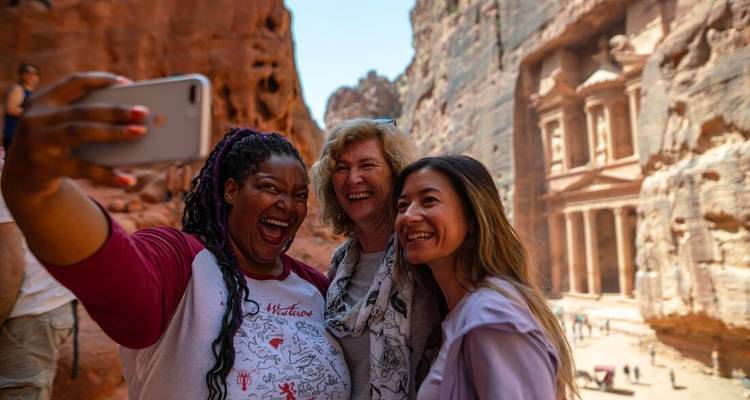 Three women taking a selfie in front of Petra