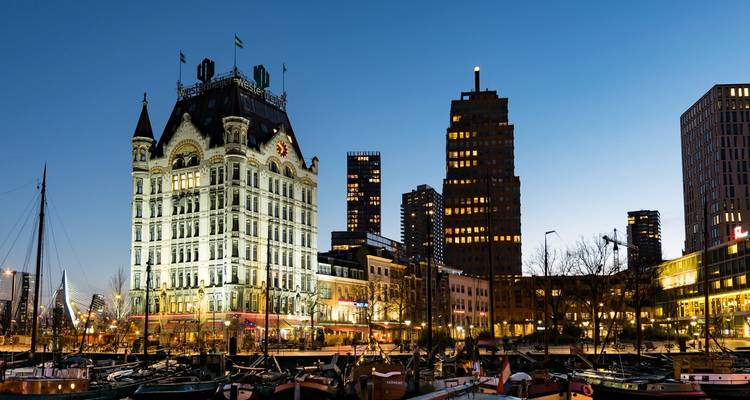 Skyline of Rotterdam with historic and modern buildings.