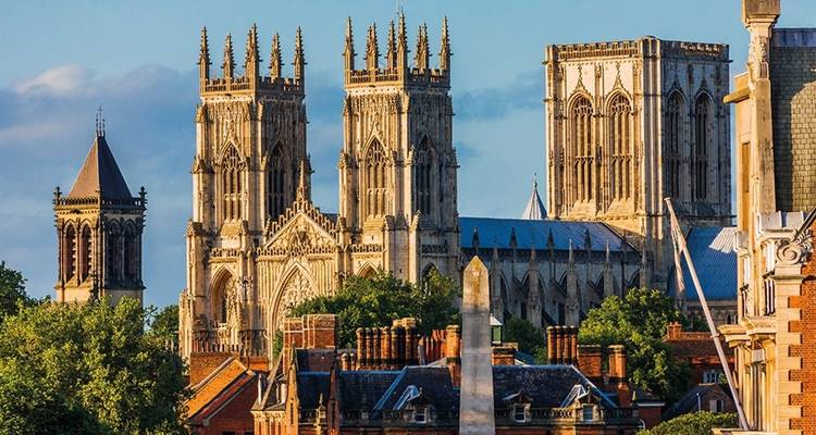 A majestic cathedral among a historic cityscape.