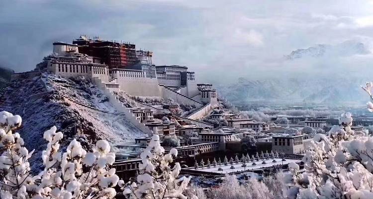 A snowy landscape showcasing a large palace-like structure.