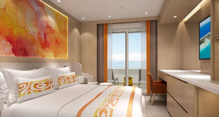 Interior lujoso de dormitorio con vista al océano.