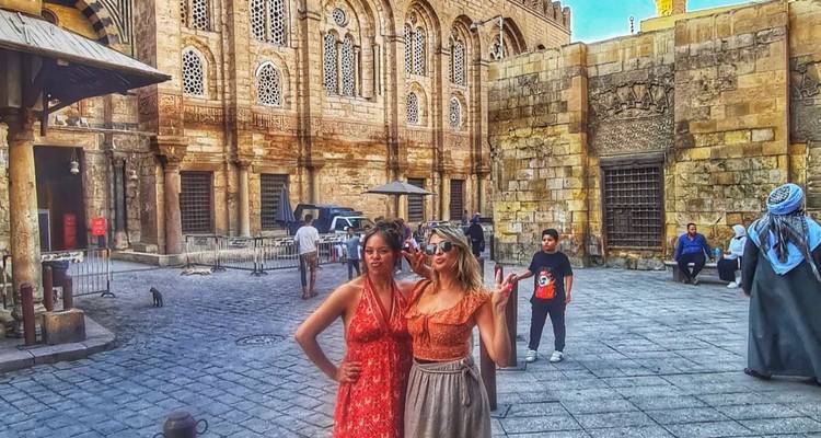 Two women posing in an Egyptian market, Cairo.