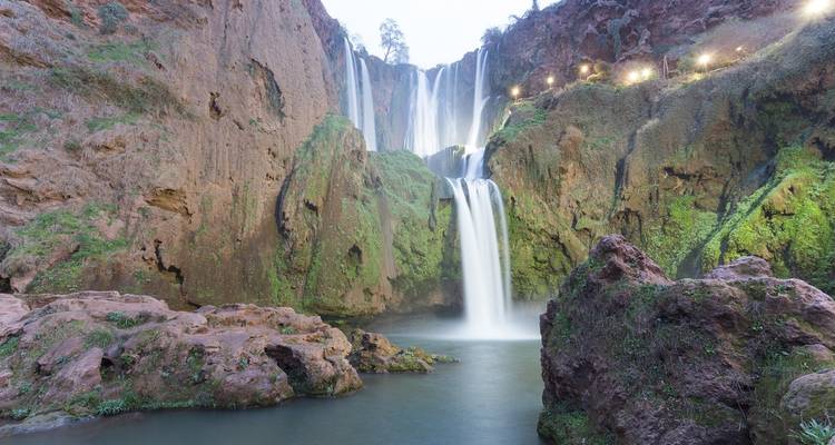 Close-up of Ouzoud Falls with cascading water and rocky surroundings.