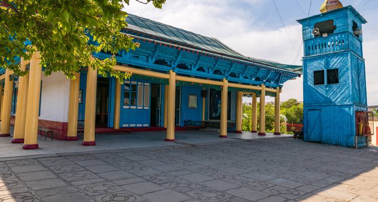 Colorful traditional building with a small tower.