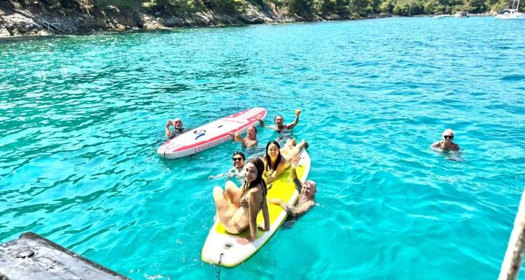 Group of people enjoying the water on paddleboards.