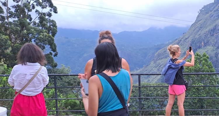 Group of people enjoying a mountain view.