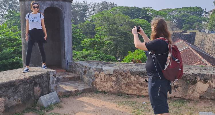 Person taking a photo on a historic fort.