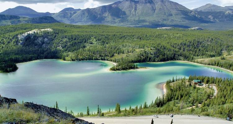 Scenic view of Emerald Lake with lush green surroundings.