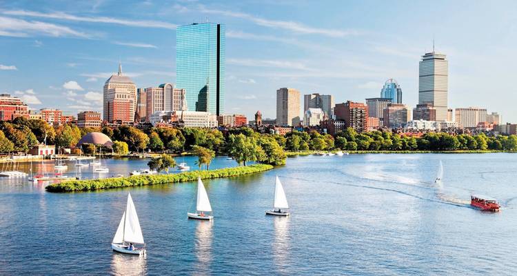 Boston skyline with sailboats on the water.