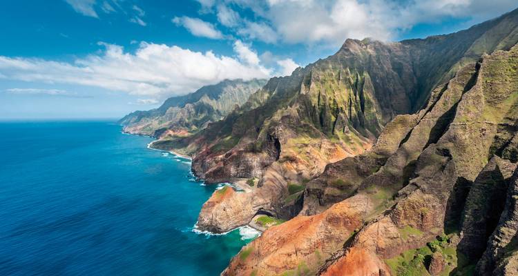 Dramatic cliffs of the Napali Coast meeting the ocean.
