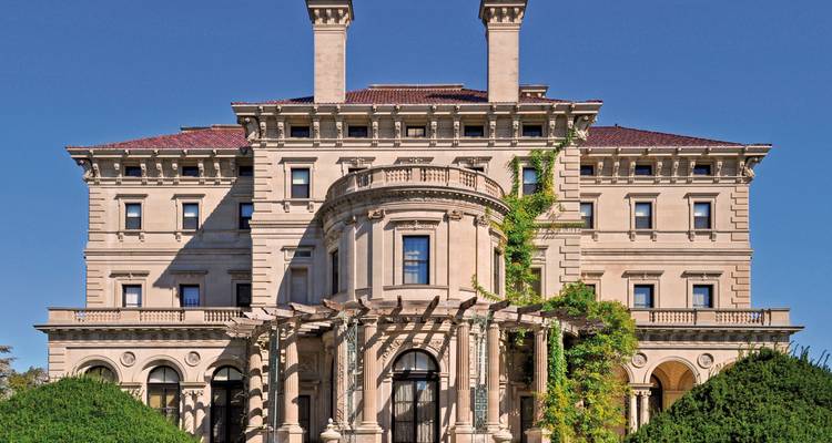 Elegant historic mansion with manicured gardens and classical architecture.