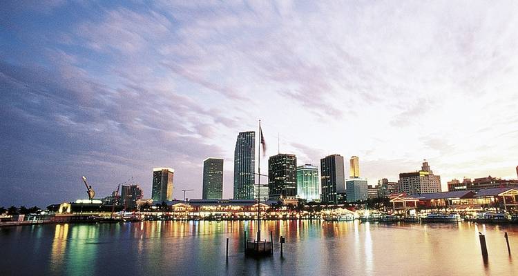 City skyline at dusk with waterfront