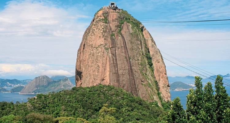 View of Sugarloaf Mountain surrounded by trees.