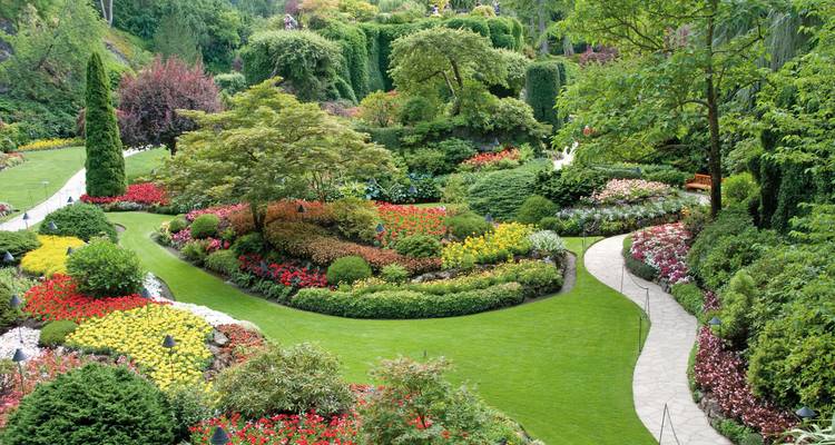 Beautifully manicured gardens with colorful flower beds.