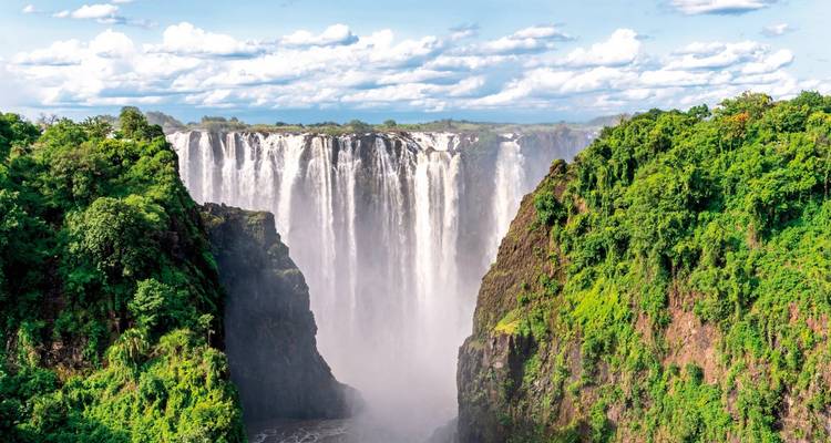 Impressive view of Victoria Falls with lush greenery.