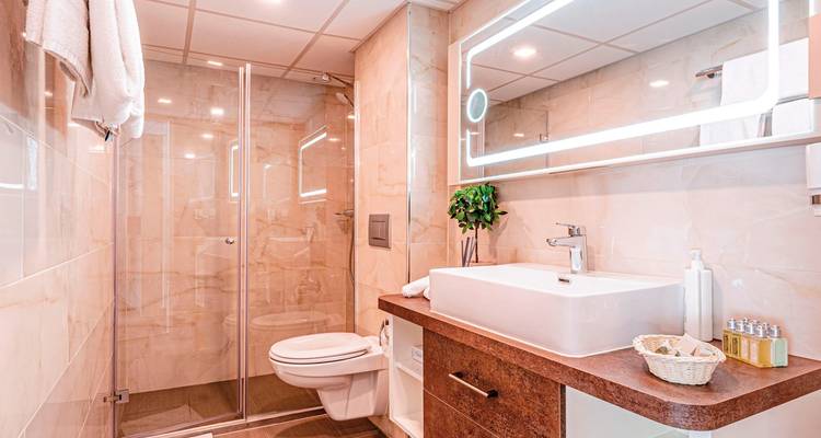Modern bathroom with a sleek design and glass shower.