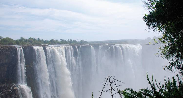 Massive waterfall with mist and spray.