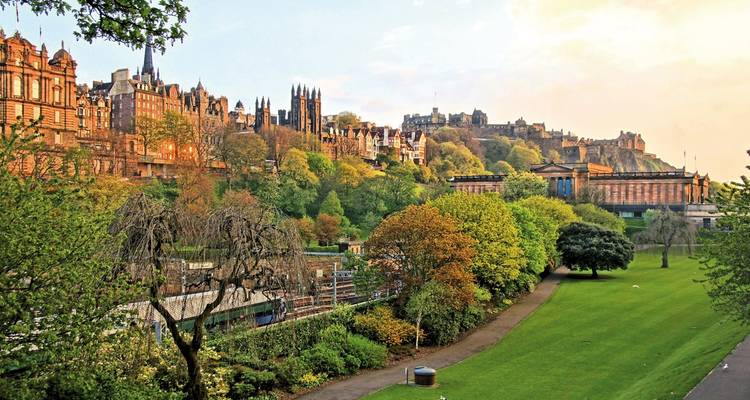 Edinburgh's cityscape with lush greenery and historic buildings.