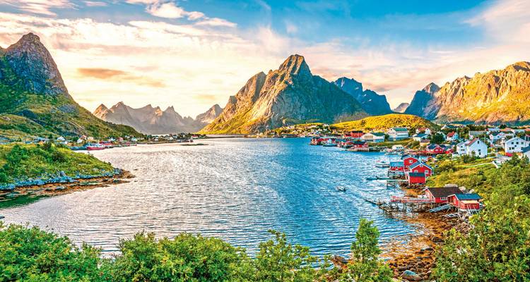 A peninsula with colorful houses and dramatic sharp peaks.