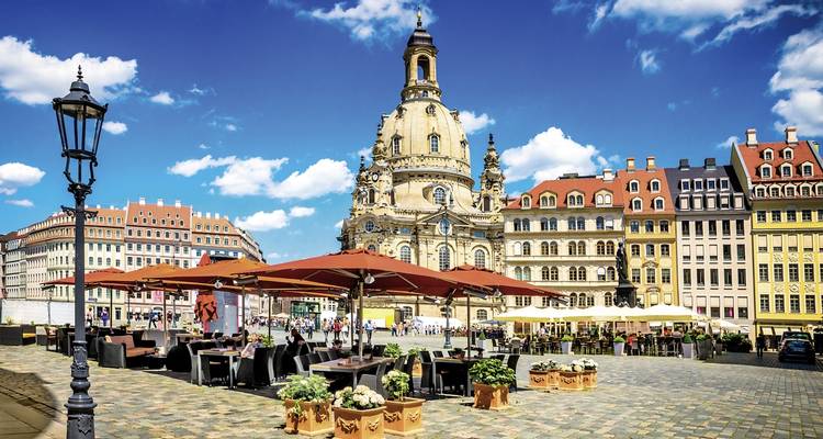 Historic church and square in a vibrant city scene.