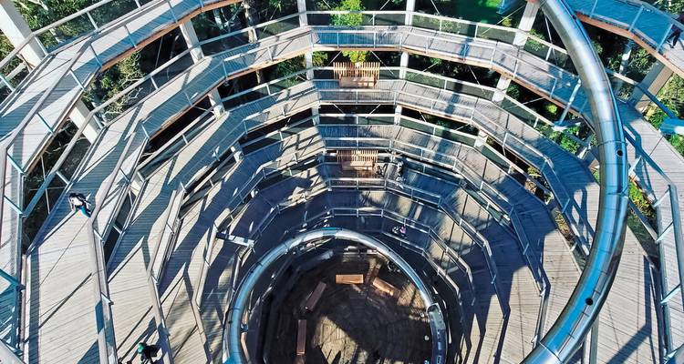 A spiral slide inside a tower structure.