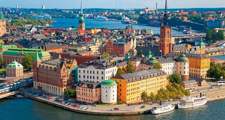 Aerial view of Stockholm with colorful buildings and a river.