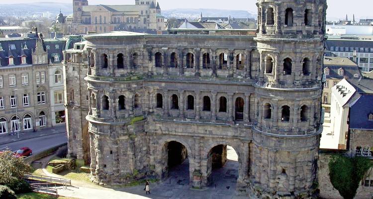 Ancient gate structure in a city setting.