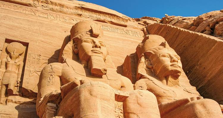Close-up view of the massive statues at the entrance of Abu Simbel temple.