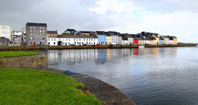 Series of colorful houses along a waterfront.